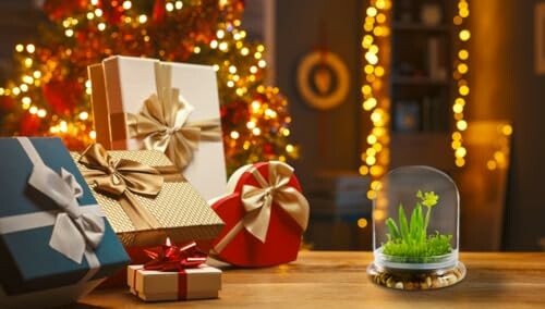 Christmas gifts on a table with a holiday background